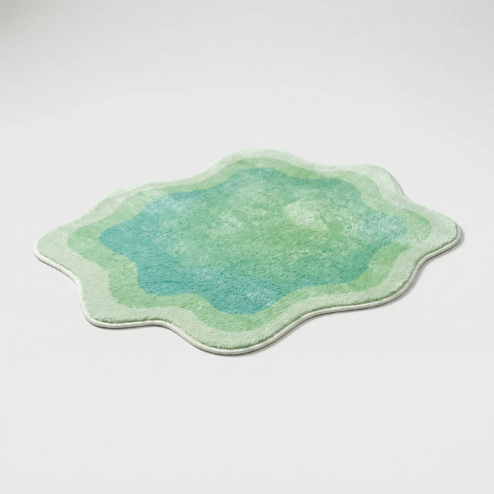Soft plush gradient area rug with wave design; a modern Flowique statement for bedroom or living room decor.
