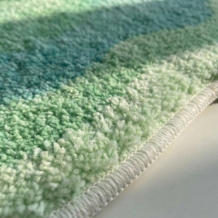 Flowique modern gradient area rug, soft plush & non-slip, ideal for living room, bedroom, or bathroom home decor.