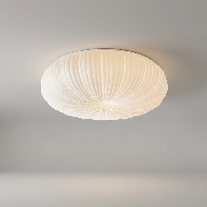 Modern flush mount LED ceiling light, Ciravine, for elegant home decor. Creates a gentle, ambient glow.