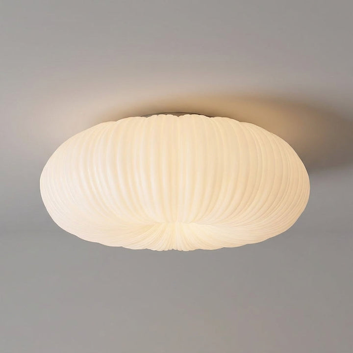 Contemporary Ciravine flush mount LED ceiling light. Delivers soft, ambient, dimmable light.