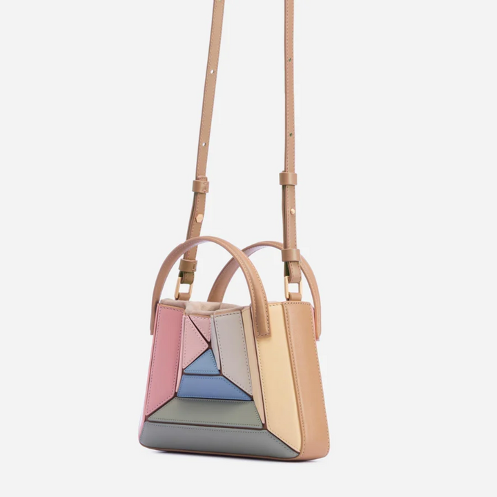 Vibrant geometric pattern shoulder bag. Modern women's fashion accessory for everyday style.