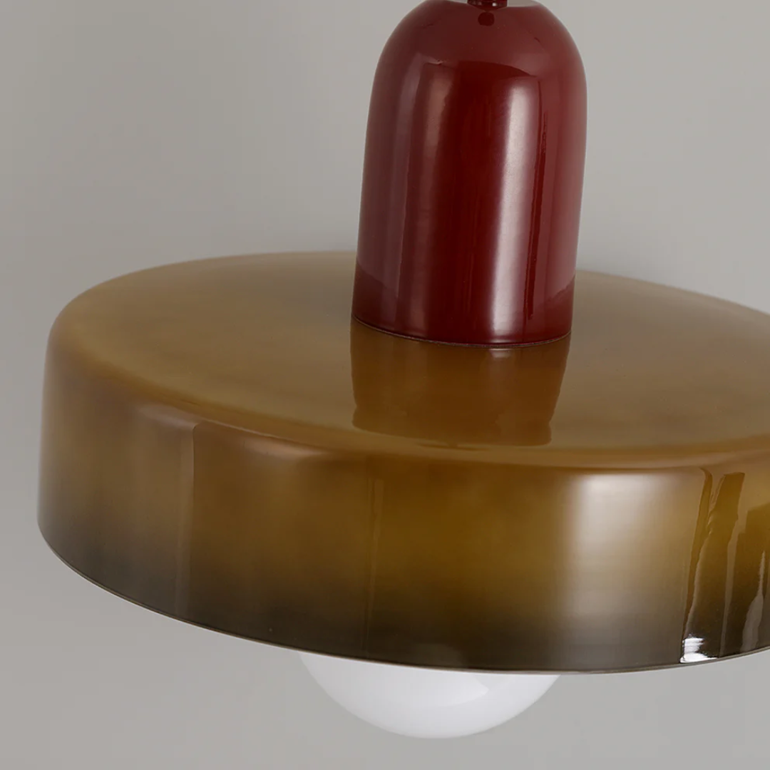 Adjustable LED pendant light, energy-efficient and sleek glass design.