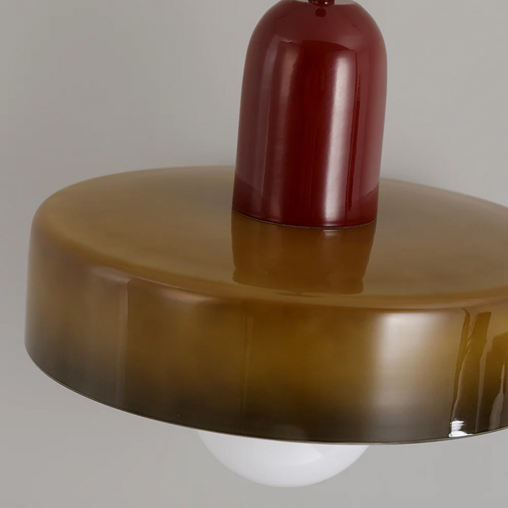 Adjustable LED pendant light, energy-efficient and sleek glass design.