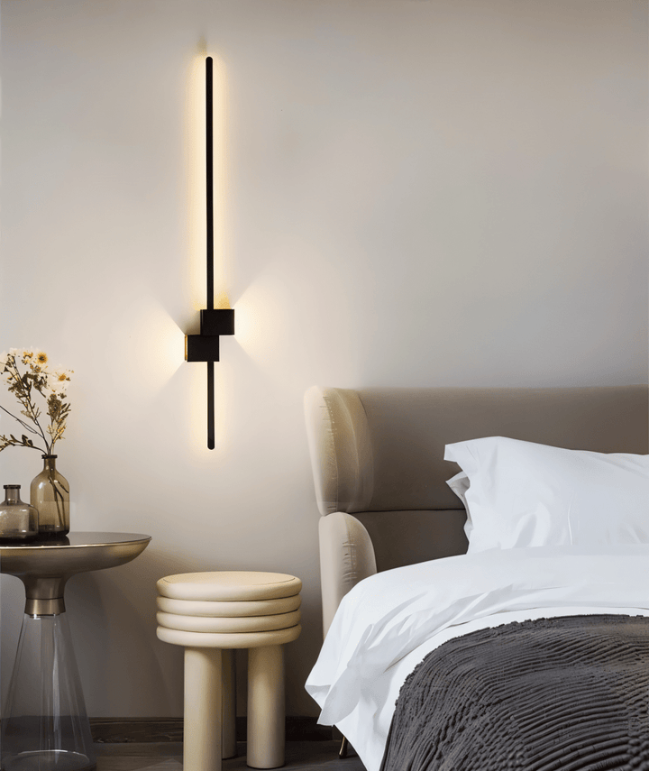 Slim linear LED wall sconce, offering soft, indirect light to create a modern and inviting ambiance.