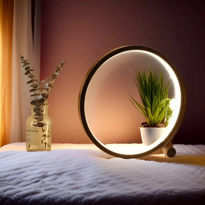 Sleek LumaCircle dimmable LED table lamp, modern round design, provides soft ambient light for any room.