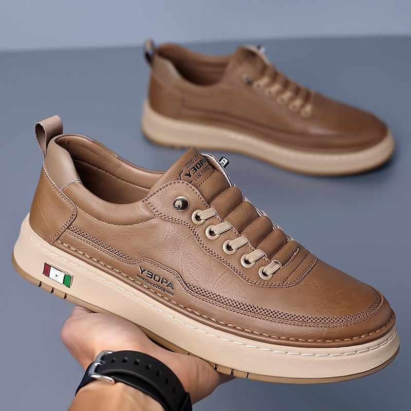 Back view of men's athletic shoes, showcasing a sleek design for modern fashion.