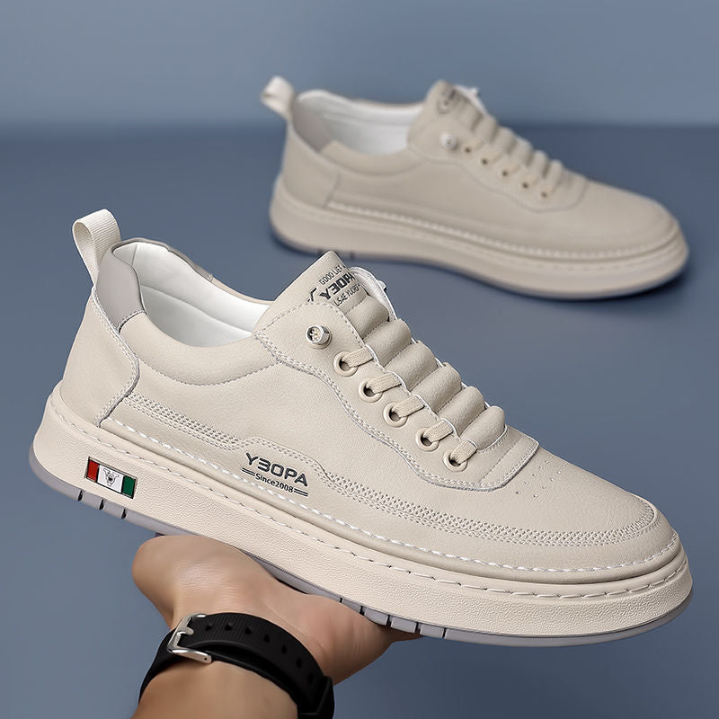 Men's modern sneakers worn on foot, highlighting their comfort and everyday style.