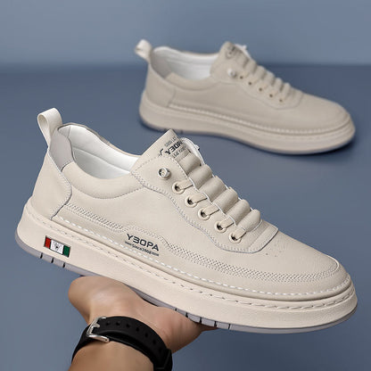 Men's modern sneakers worn on foot, highlighting their comfort and everyday style.