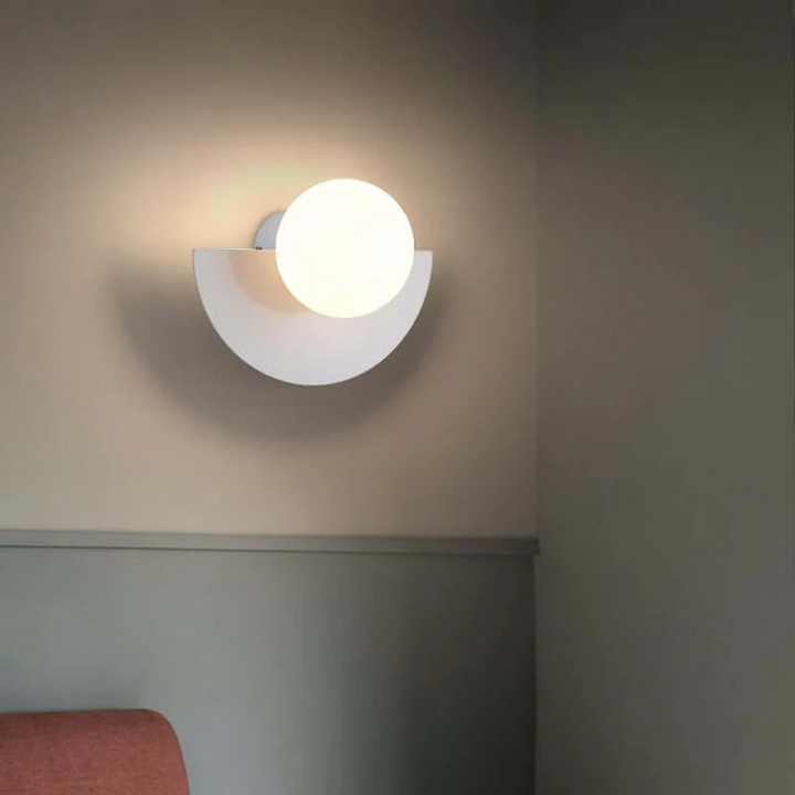 Modern metal half moon LED wall lamp, sleek design for contemporary interiors.