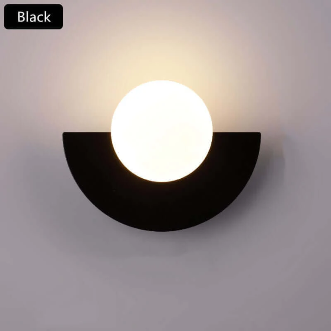 Stylish metal half moon LED wall light, offering contemporary interior illumination for modern homes.