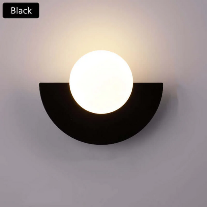 Stylish metal half moon LED wall light, offering contemporary interior illumination for modern homes.