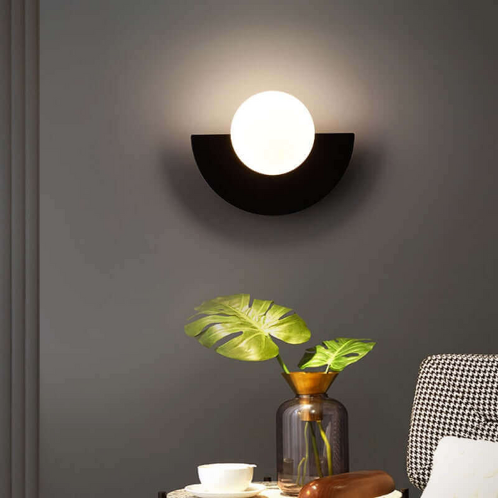 Energy-efficient LED half moon wall lamp, modern metal design for bright interior lighting.