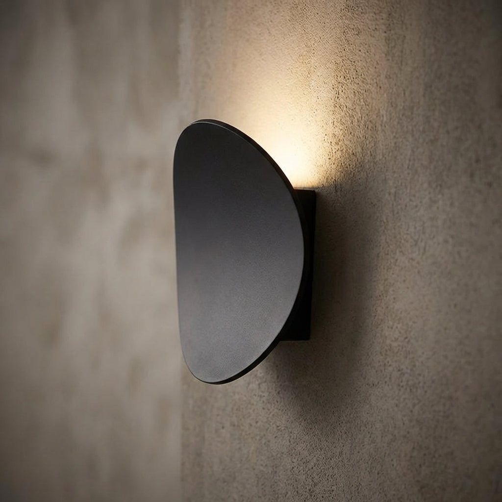 Modern minimalist LED wall sconce, Serevex, provides ambient uplight for contemporary home decor. Energy efficient aluminum fixture.