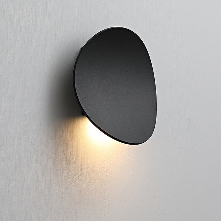 Elegant minimalist LED wall sconce, Serevex, adds modern ambient light to any indoor space. Perfect for home decor.