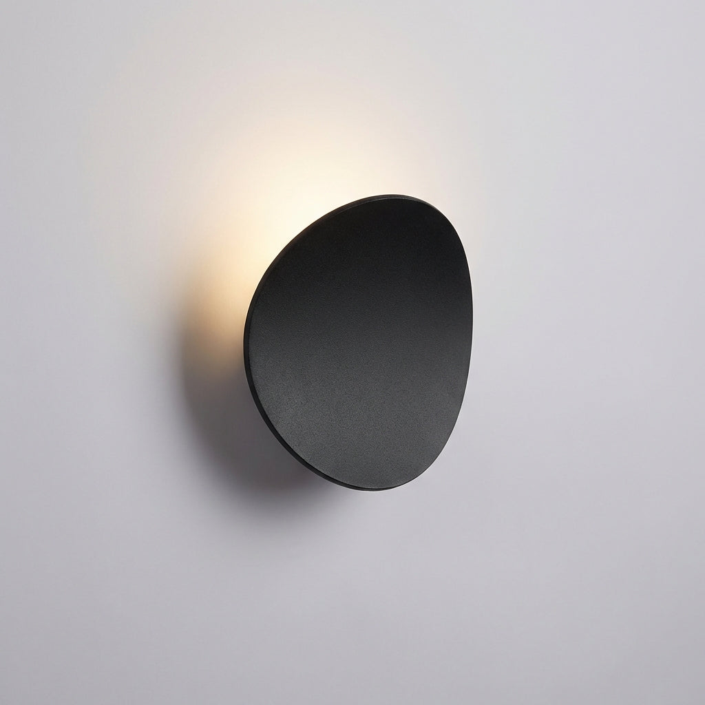 Energy-efficient LED minimalist wall sconce by Serevex. Modern aluminum fixture provides soft ambient indoor lighting.