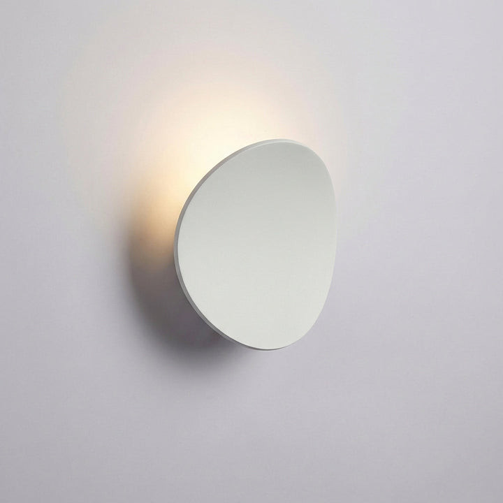 Contemporary Serevex minimalist LED wall sconce. Aluminum fixture providing modern, energy-efficient ambient uplight for indoors.