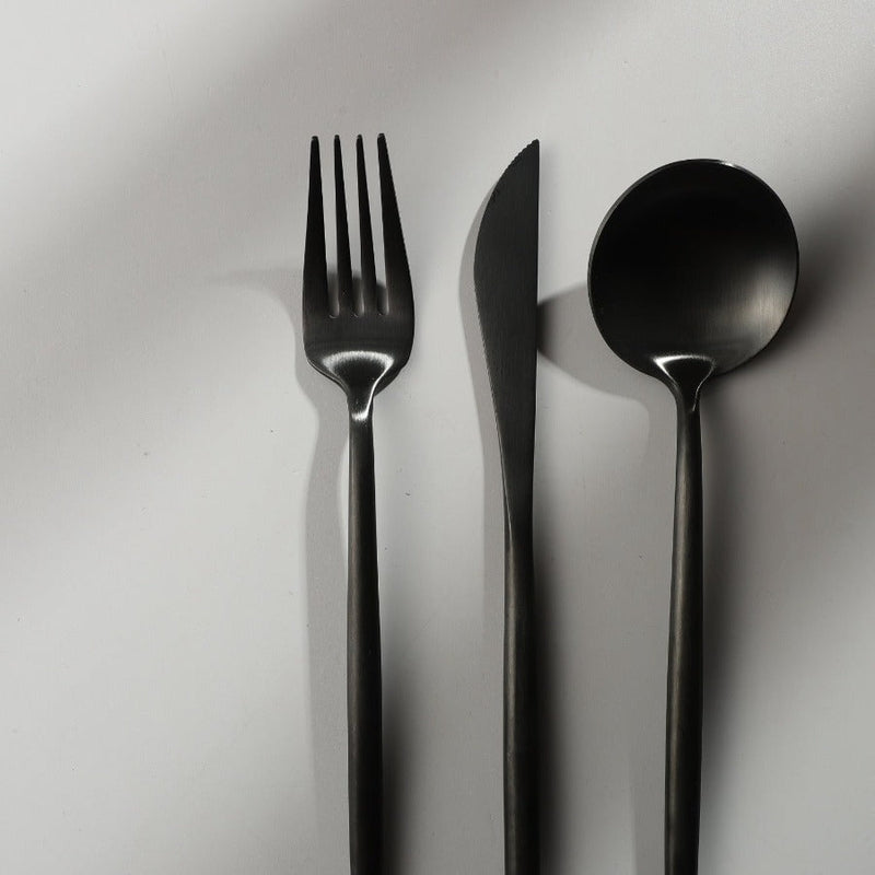 Minimalist matte black cutlery set, perfect for stylish home decor and entertaining.