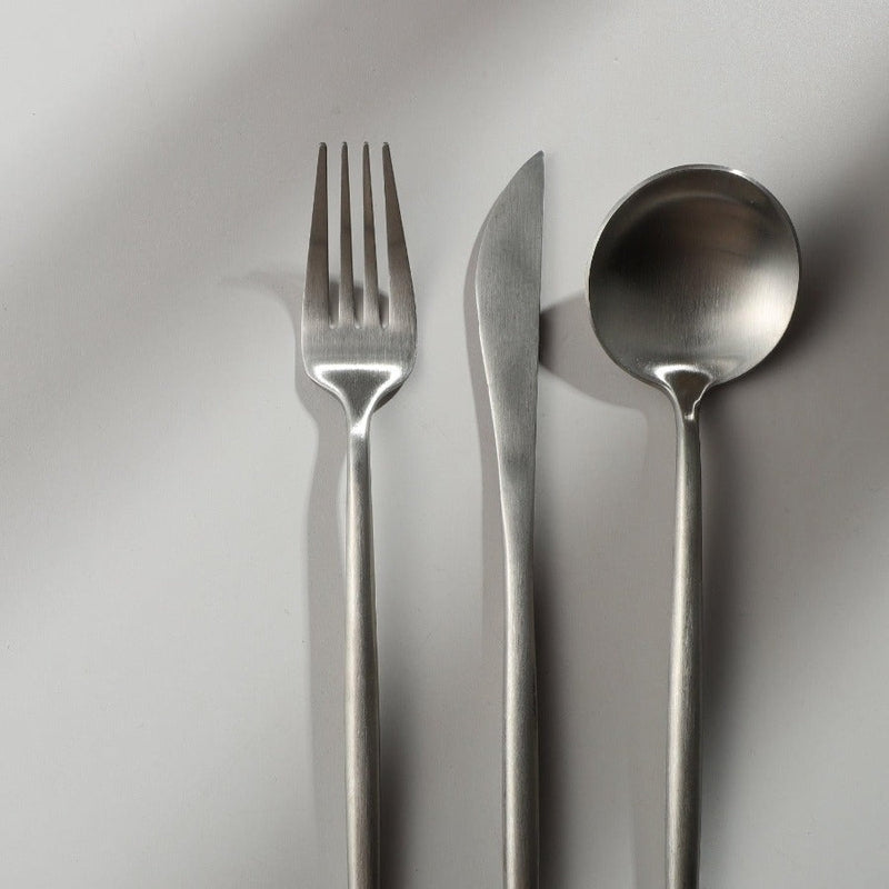 Matte silver flatware set, clean and modern for sophisticated dinnerware.