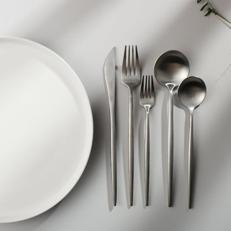 Elegant matte gold minimalist flatware set, perfect for modern kitchen and dining.