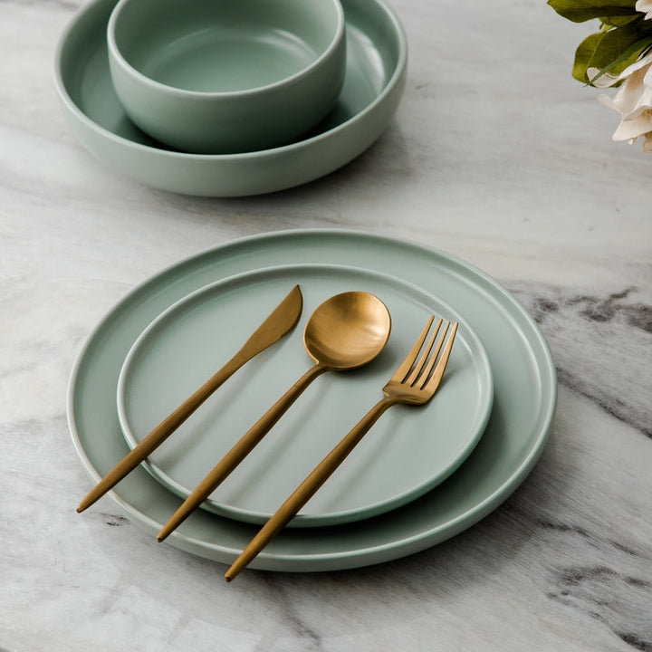 Elegant rose gold flatware set for entertaining, showcasing modern tableware design.