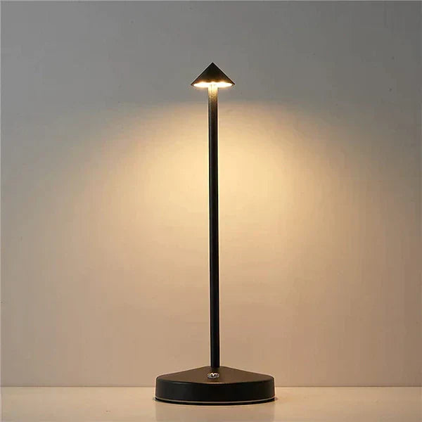 Modern minimalist portable LED table lamp for versatile home decor. Rechargeable & cordless ambiance light.