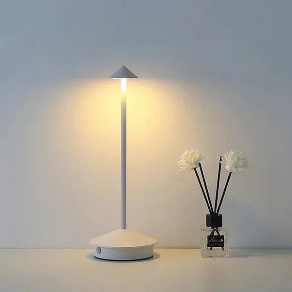 Sleek aluminum minimalist LED table lamp. Cordless & portable, perfect for modern bedroom or living room decor.