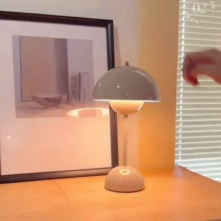 Chic mushroom table lamp in a modern design. Perfect dimmable lighting for a contemporary living room.