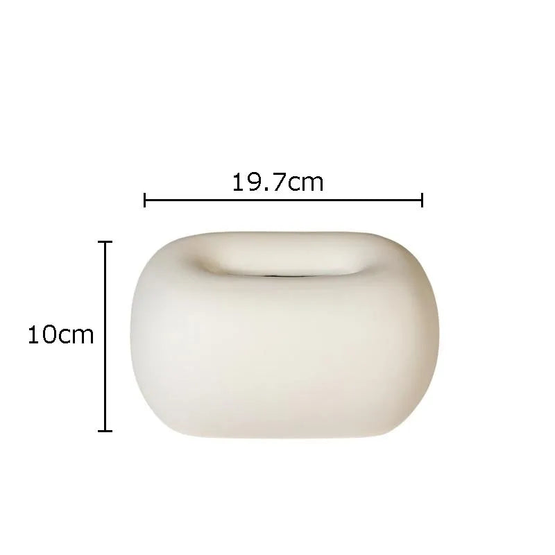 Versatile modern ceramic tissue holder, perfect for stylish home decor in bathroom, living room, or office.