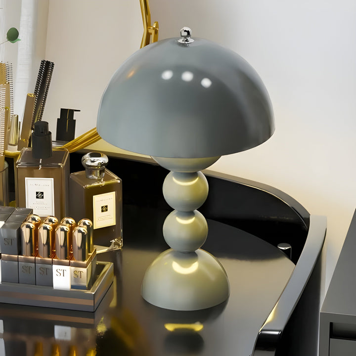 Modern dimmable LED bedside lamp, unique flower bud design, soft ambient light.