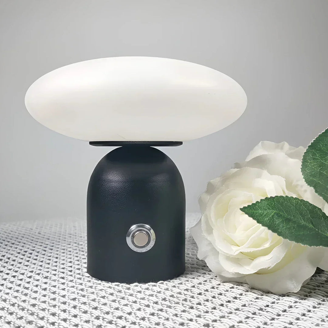 Elegant modern LED mushroom table lamp. Black, wireless, and smart touch controlled, ideal for stylish ambiance.
