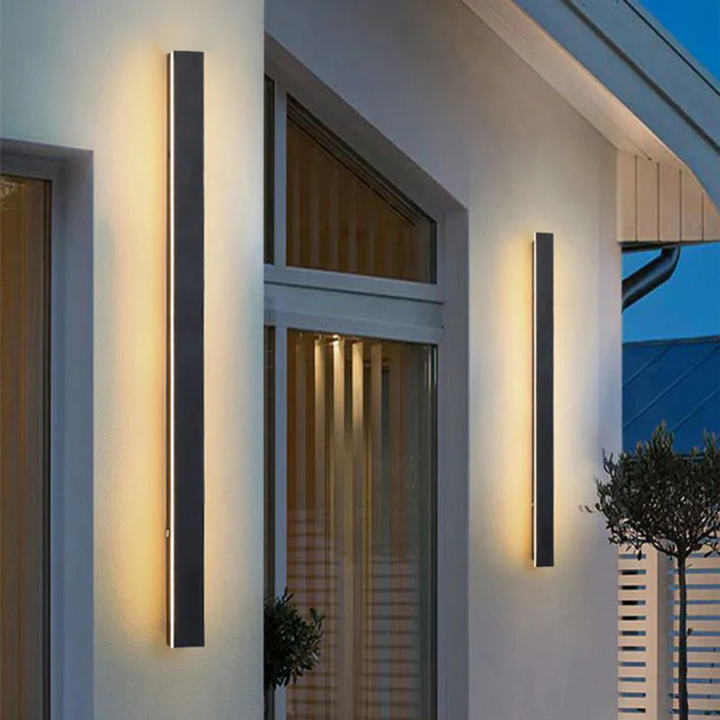 Dimmable LineaGlow LED wall lamp, providing adjustable exterior lighting for ambiance.
