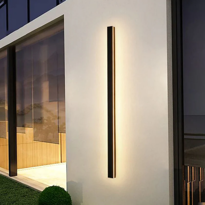 Dimmable LineaGlow LED wall lamp, sleek minimalist design for any modern exterior.