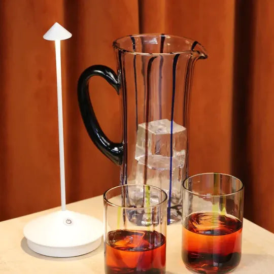 Stylish portable LED lamp, dimmable for bedside, patio, or home decor.