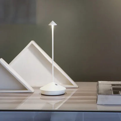 Sleek portable LED table lamp, dimmable for accent lighting & modern home style.