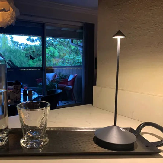 Versatile dimmable LED lamp, wireless and portable for any room or outdoor space.