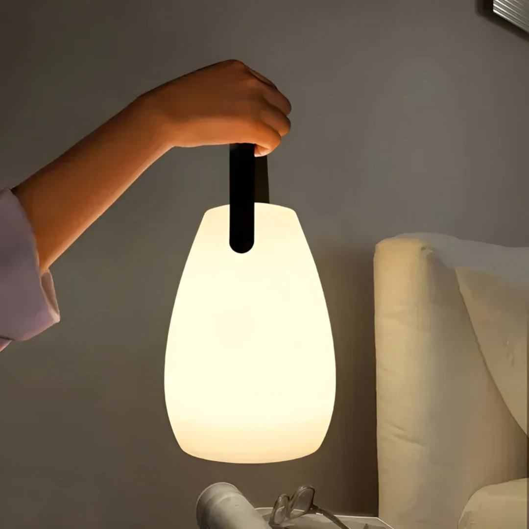 Modern portable waterproof wireless LED table lamp, perfect for indoor & outdoor accent lighting.