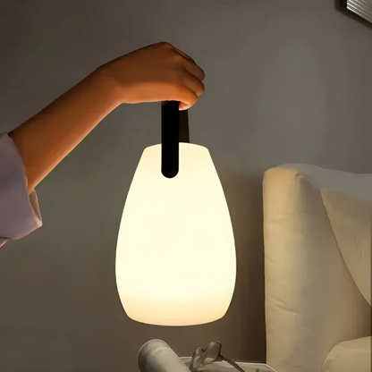 Modern portable waterproof wireless LED table lamp, perfect for indoor & outdoor accent lighting.