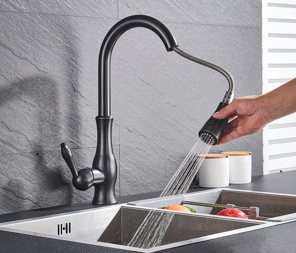 Brushed steel FlexFlow retractable kitchen faucet, perfect for any contemporary kitchen sink.