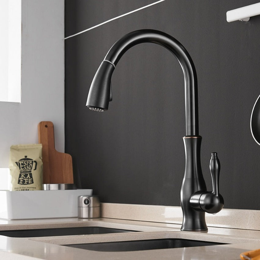 Elegant gold FlexFlow pull-out kitchen faucet. Luxurious design enhances your modern kitchen.