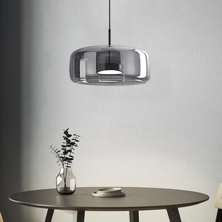 Elegant glass LED pendant lamp, blending modern and retro design for unique home decor.