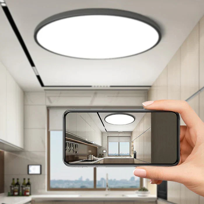 Sleek modern round LED ceiling light, sophisticated energy-efficient lighting for contemporary homes.