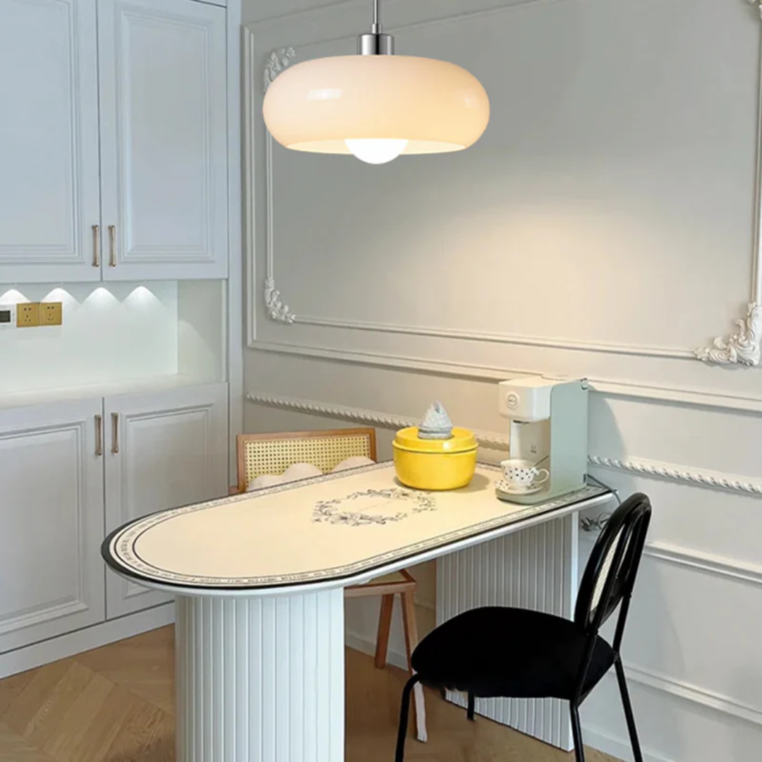 Adjustable warm white LED round pendant light, creating inviting ambiance in modern living spaces.