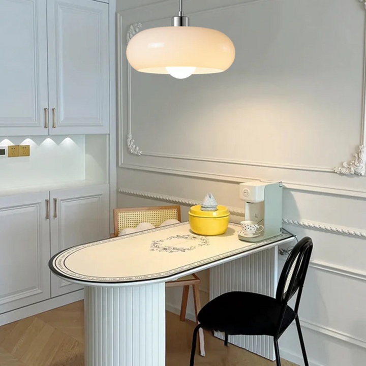 Adjustable warm white LED round pendant light, creating inviting ambiance in modern living spaces.
