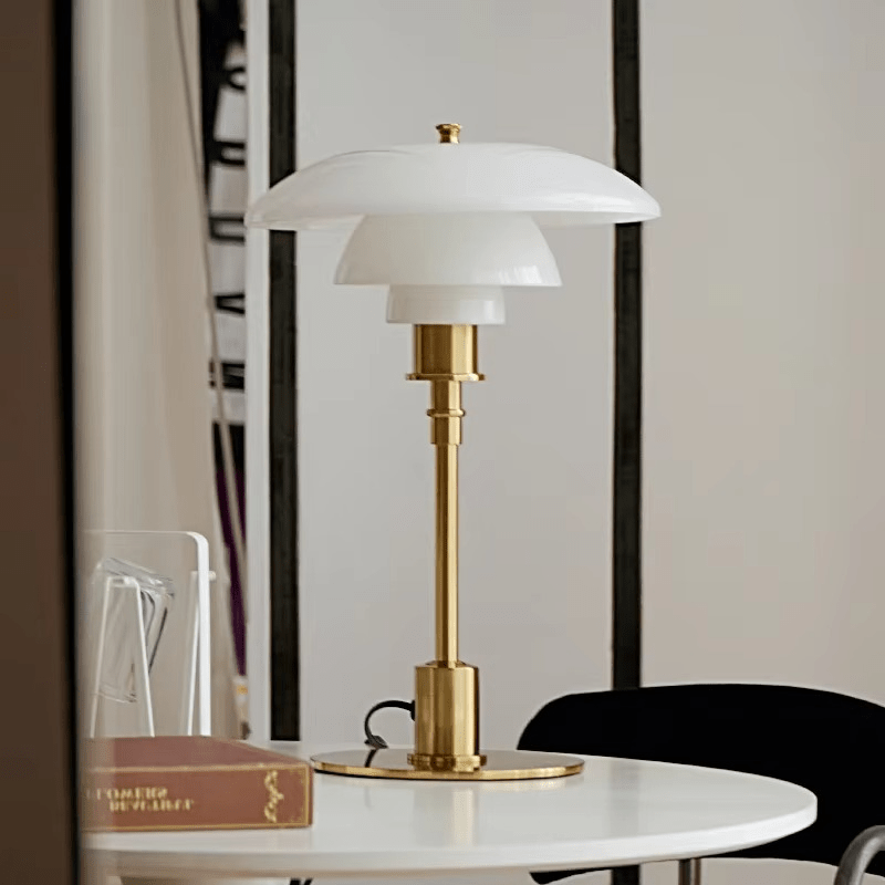 Minimalist Scandinavian LED table lamp with a stylish iron base & glass shade, providing dimmable ambient light.