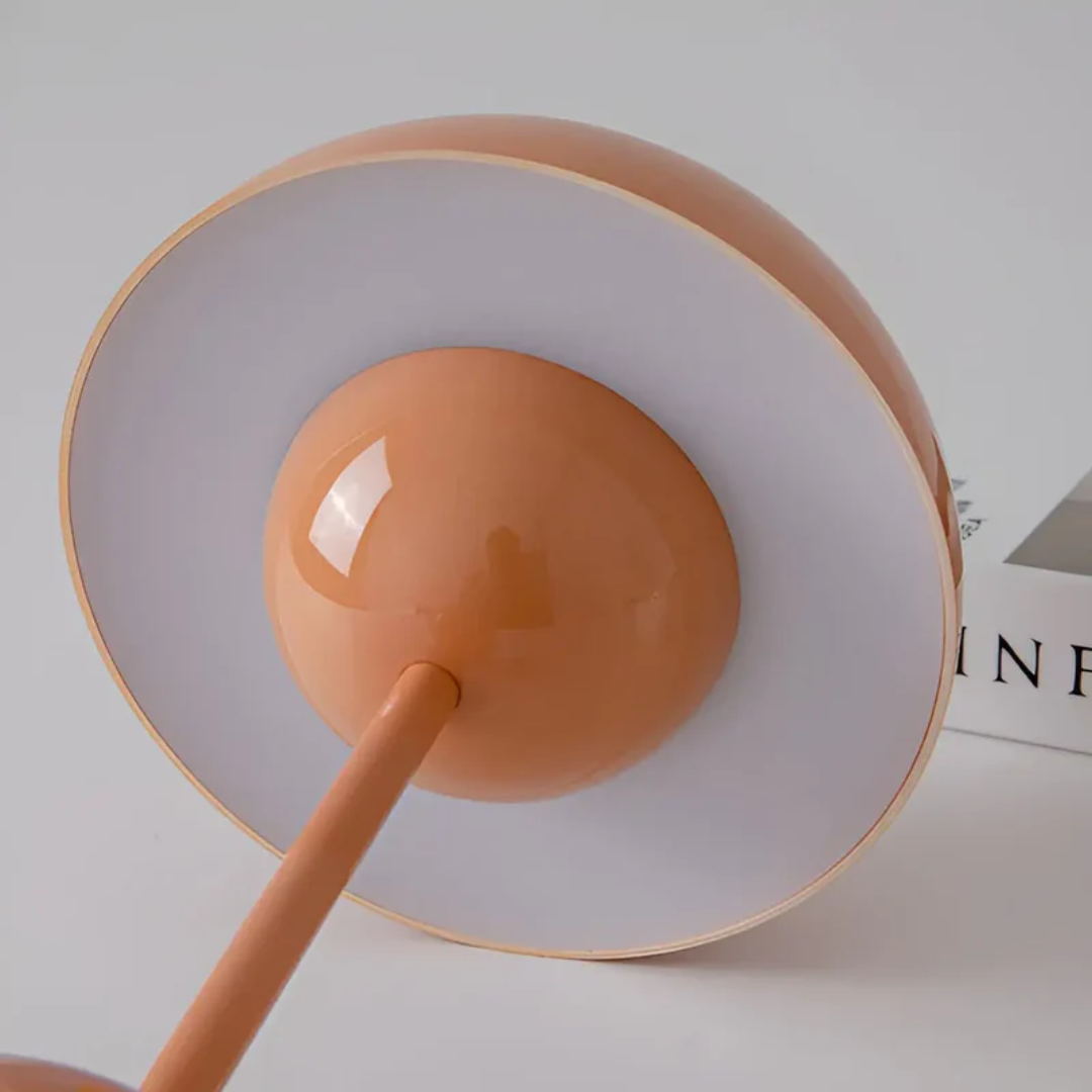 Rechargeable LED table lamp, modern Scandinavian aesthetic, offers versatile lighting without cords.