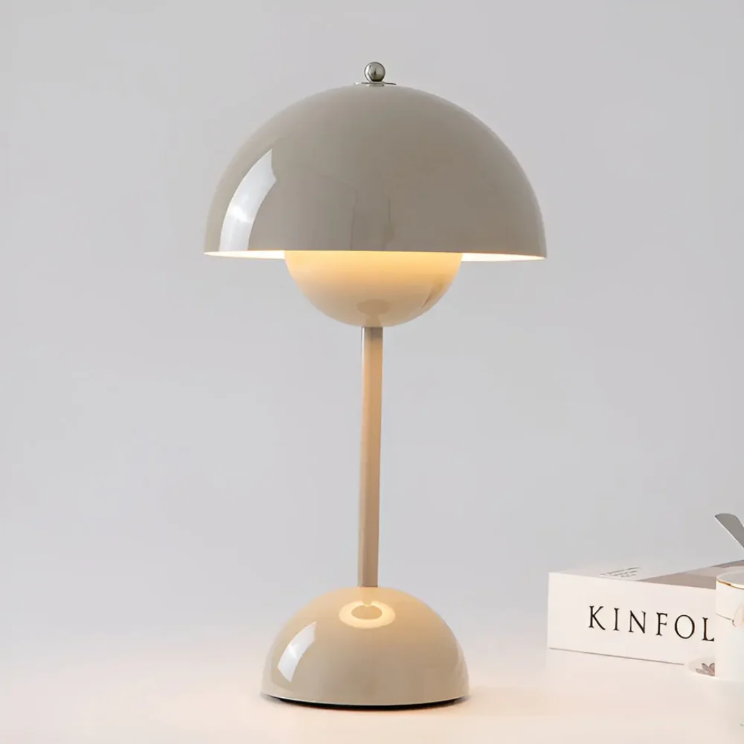 Adjustable LED table lamp, portable and wireless, featuring a clean Scandinavian aesthetic for any setting.