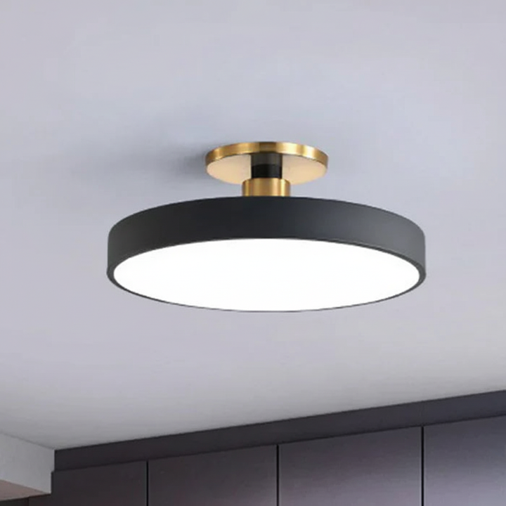 Semi-recessed LED ceiling light with acrylic lamp, Helligon, provides soft, modern home lighting.