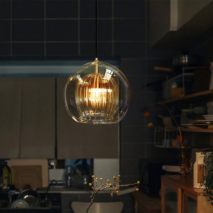 Dining room spherical LED pendant light, creating a contemporary ambiance.