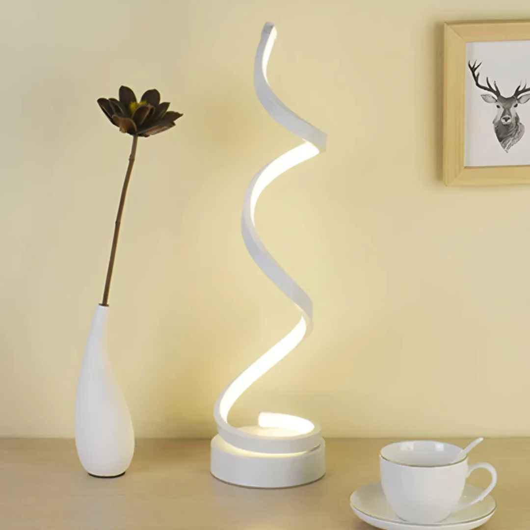 Elegant white spiral LED table lamp, dimmable, offers eye comfort and energy-efficient ambient light.