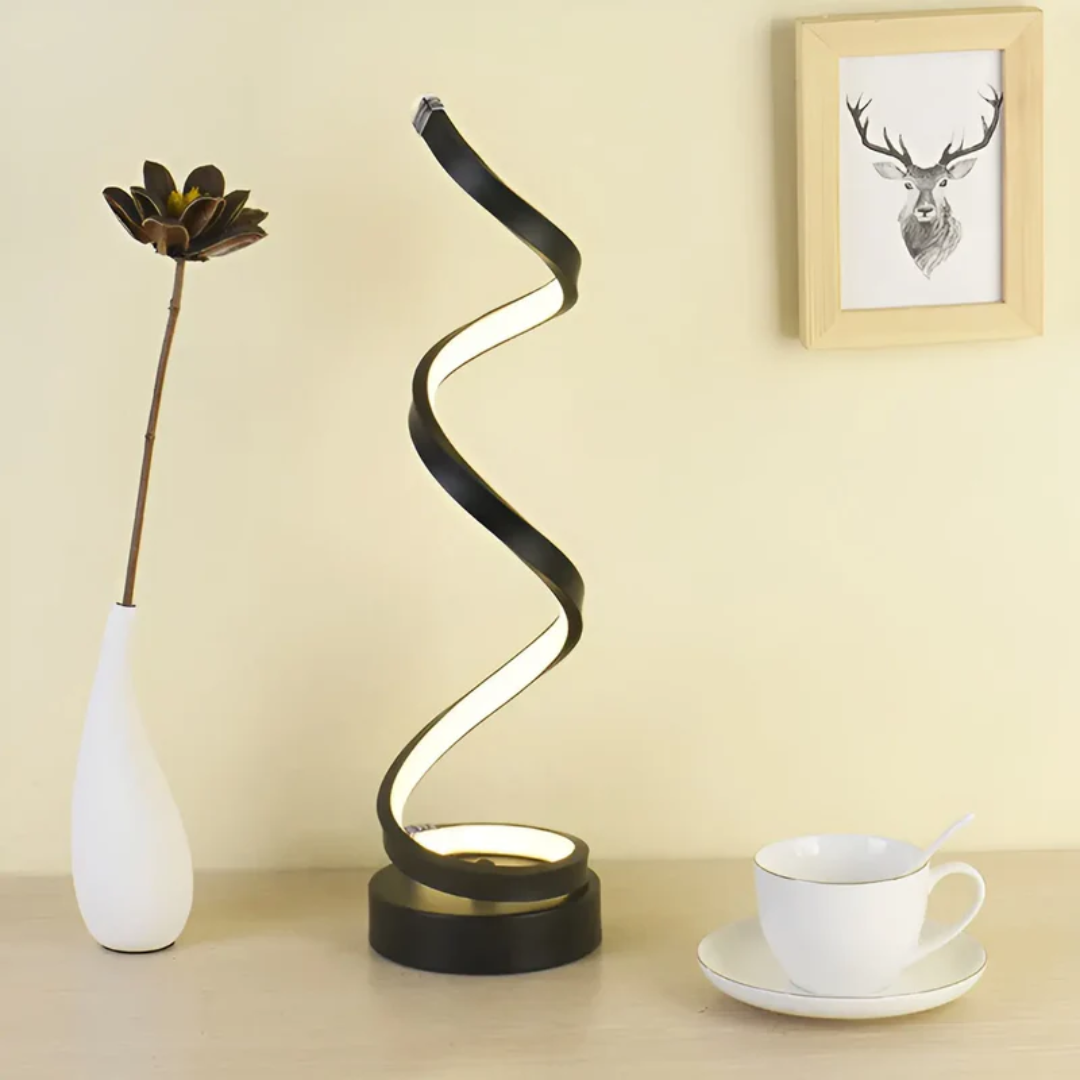 Luxurious gold modern spiral LED table lamp, dimmable, enhancing home decor with warm ambient light.